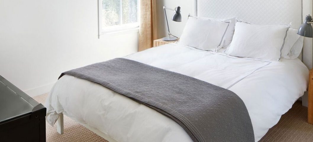 White and gray bed in bedroom