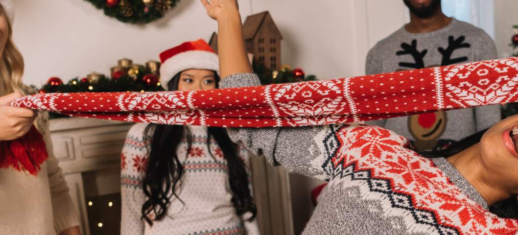 friends playing christmas party games and activities