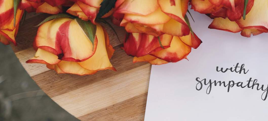 sympathy card and flowers