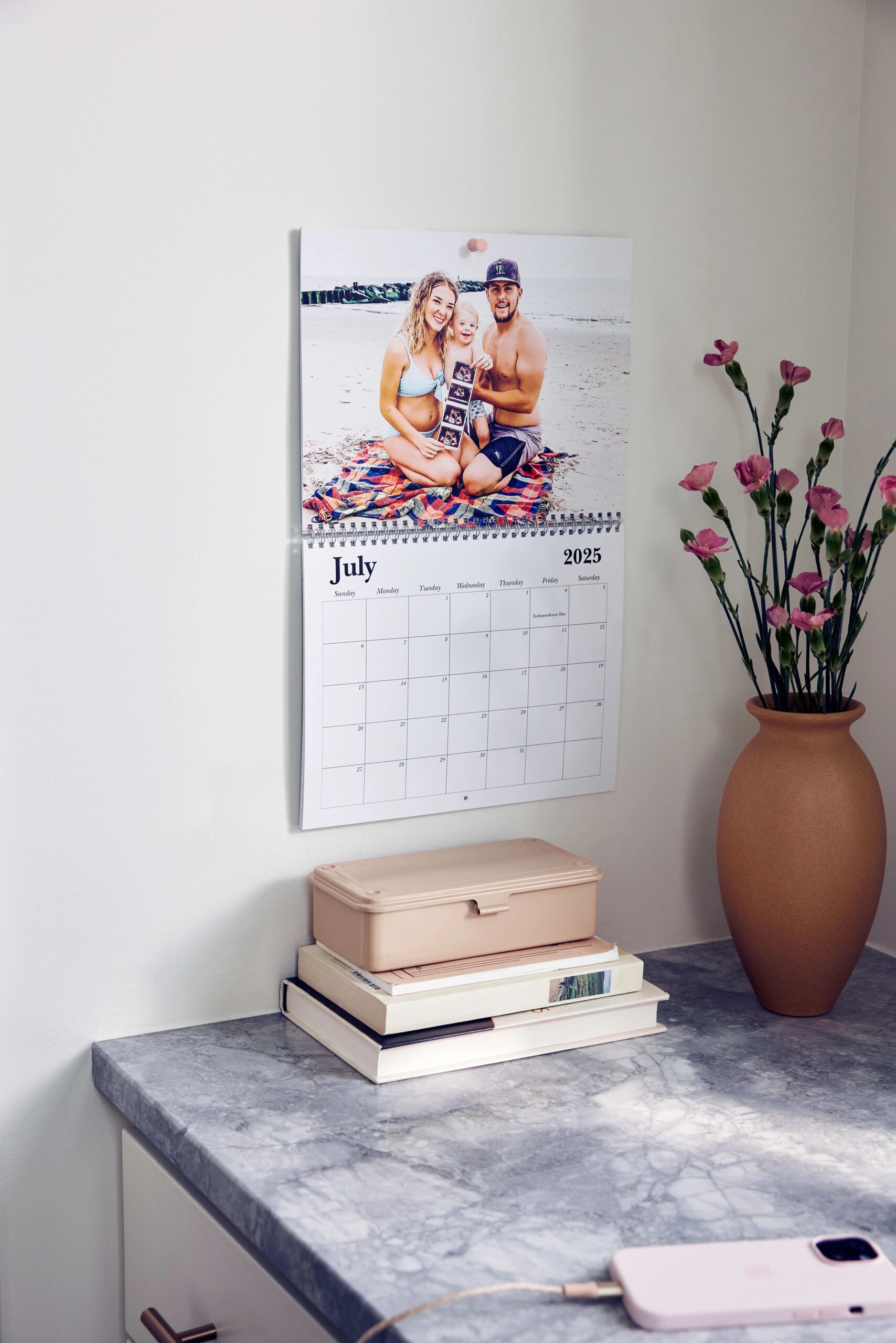 custom wall calendar hanging on wall with photo of couple