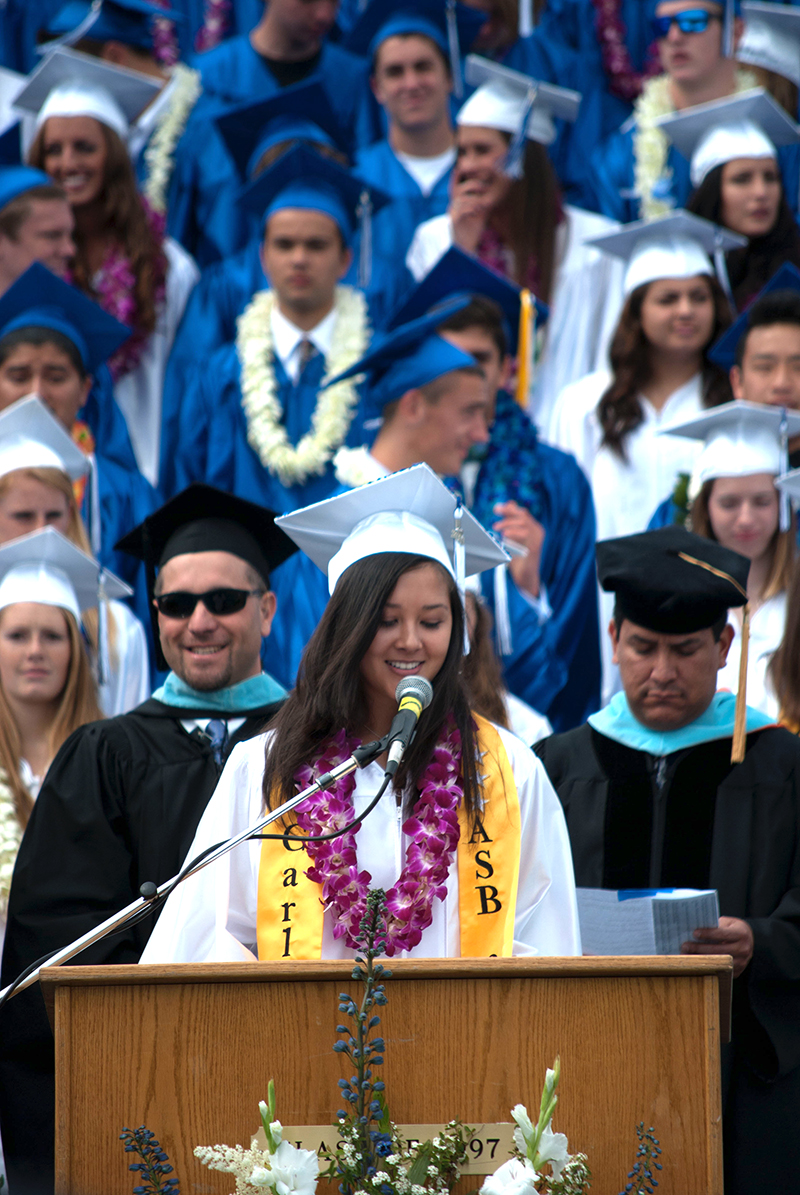 valedictorian giving speech at graduation ceremony