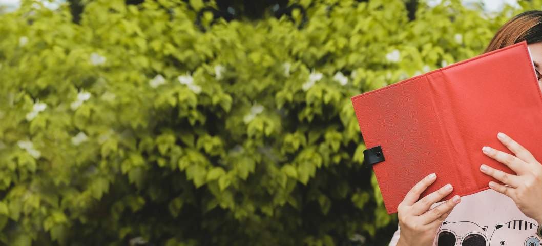 girl with a book outside