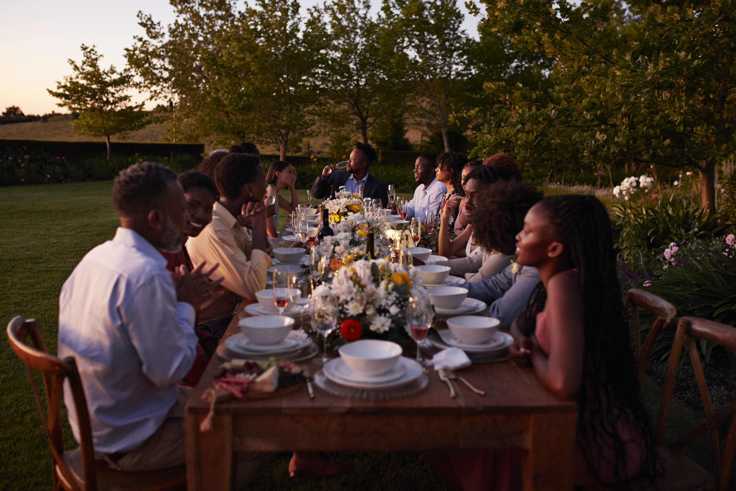 people gathered at a table at a dinner party
