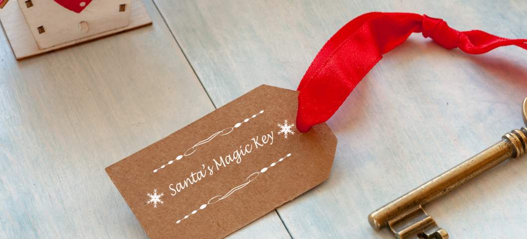 Christmas decoration - Santa's Magic Key. Close-up on light blue wooden background