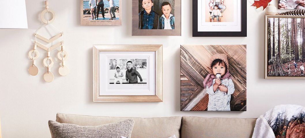 framed photos over couch