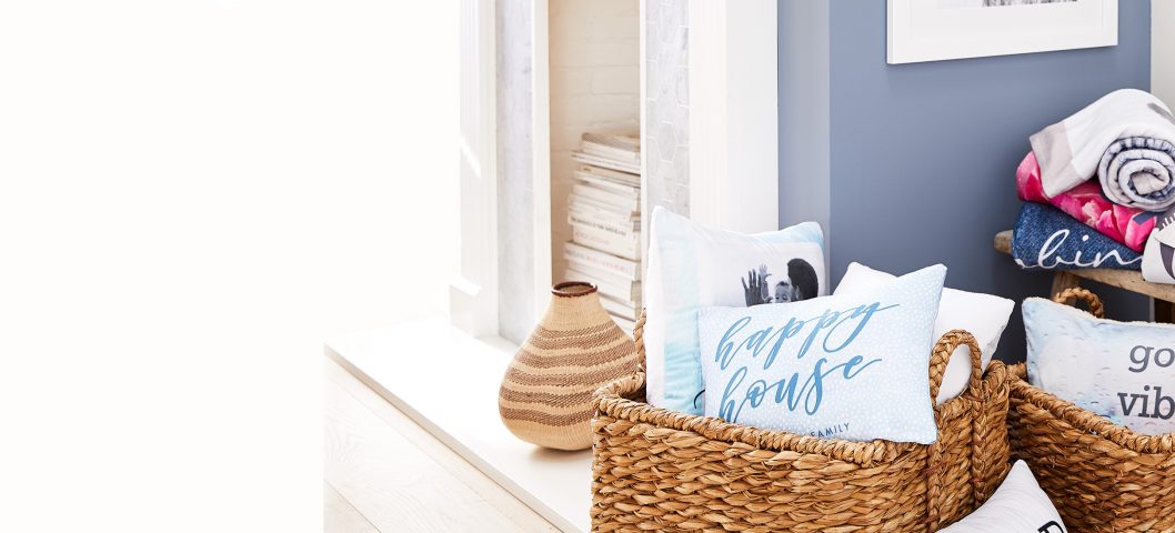 living room corner with baskets and pillows