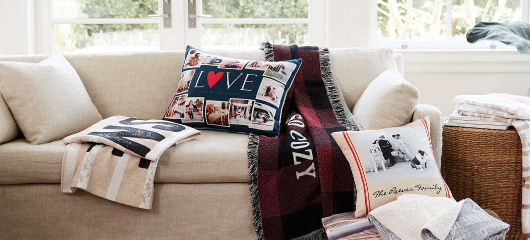 living room couch with pillows and blankets