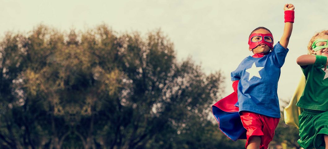 Young boys in super hero costumes.