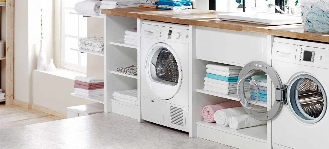 Washer and dryer with shelves.