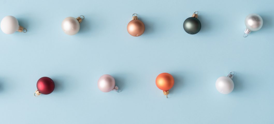 Minimal colorful Christmas baubles in pastel colors.