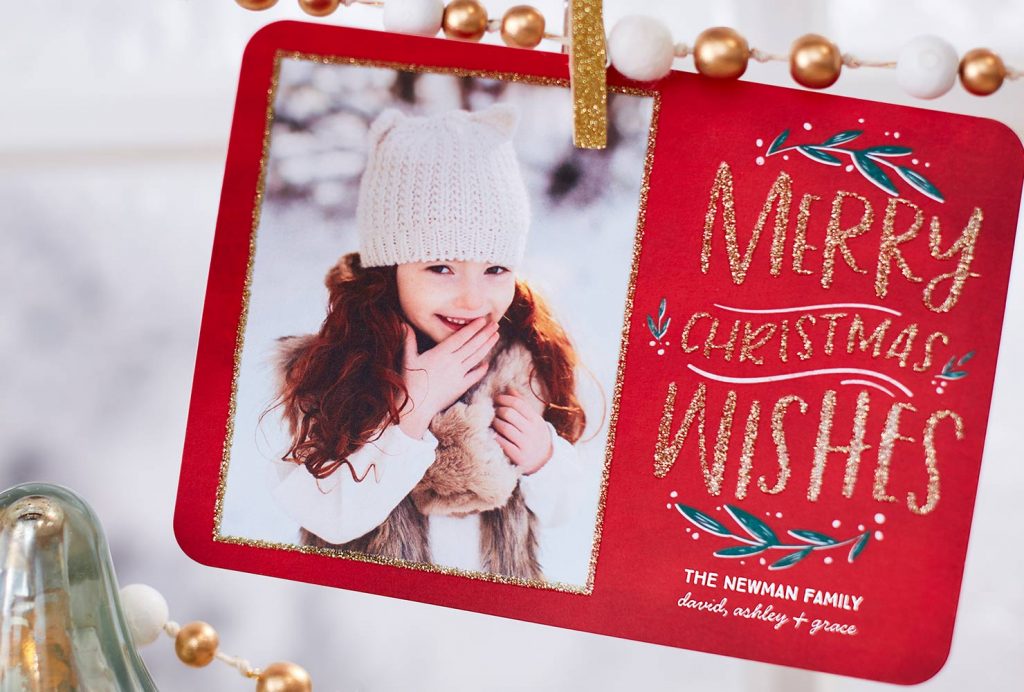 Red holiday card with picture of girl.