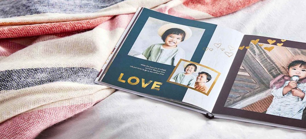 Open photo book on a blanket.