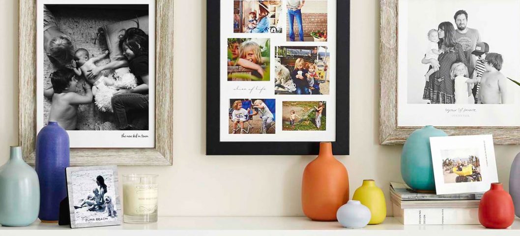 Framed family pictures hanging on wall.