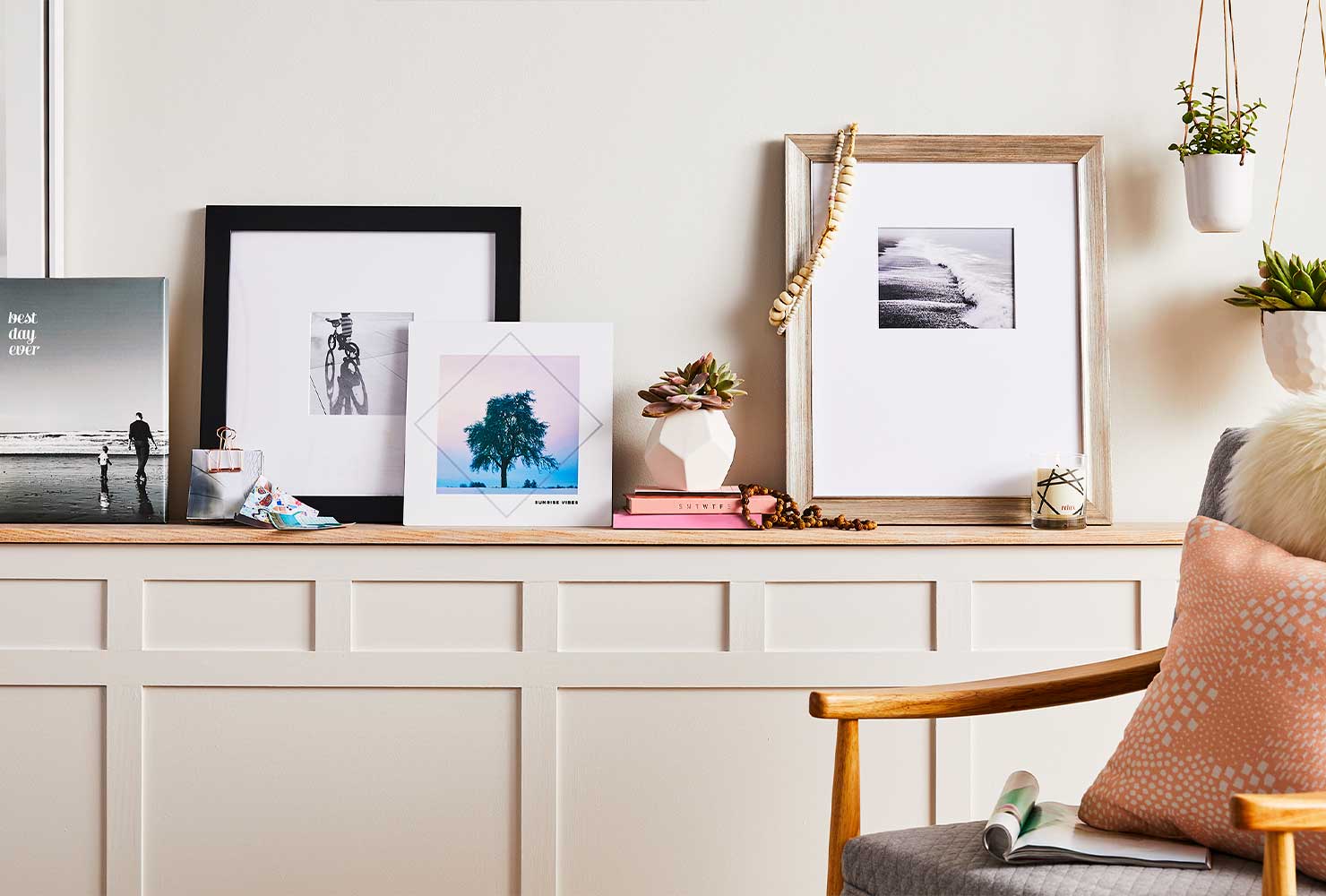 Picture frames leaning on shelf.