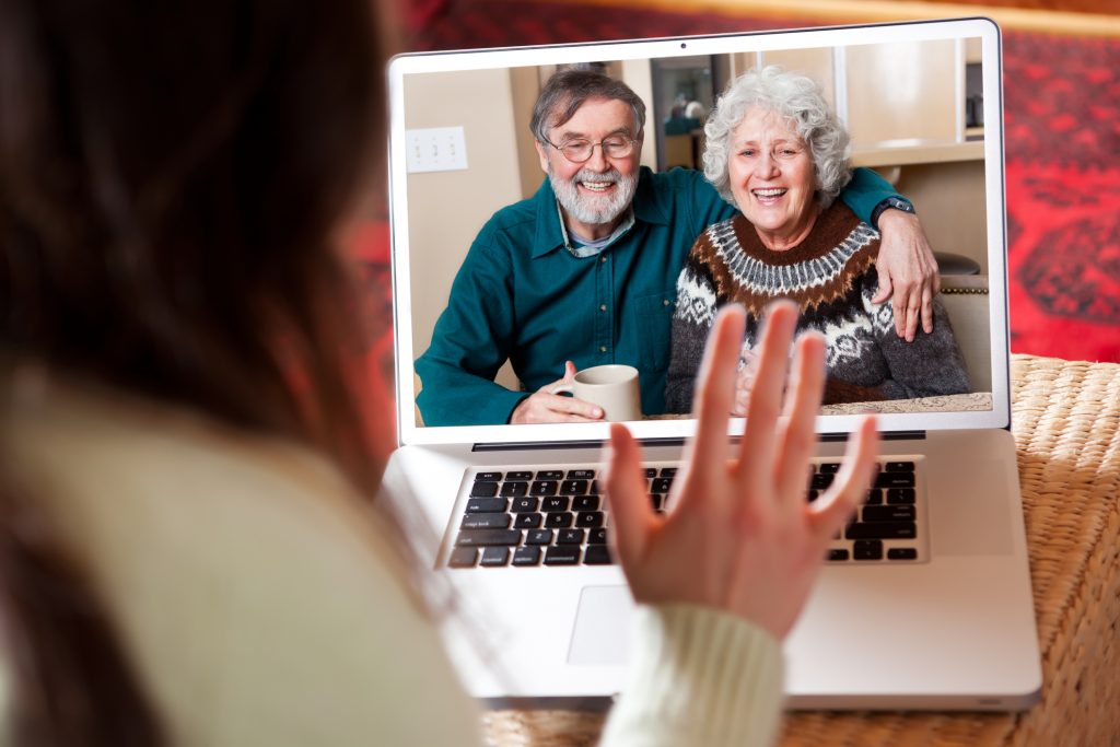 A shot of a senior couple video conferencing