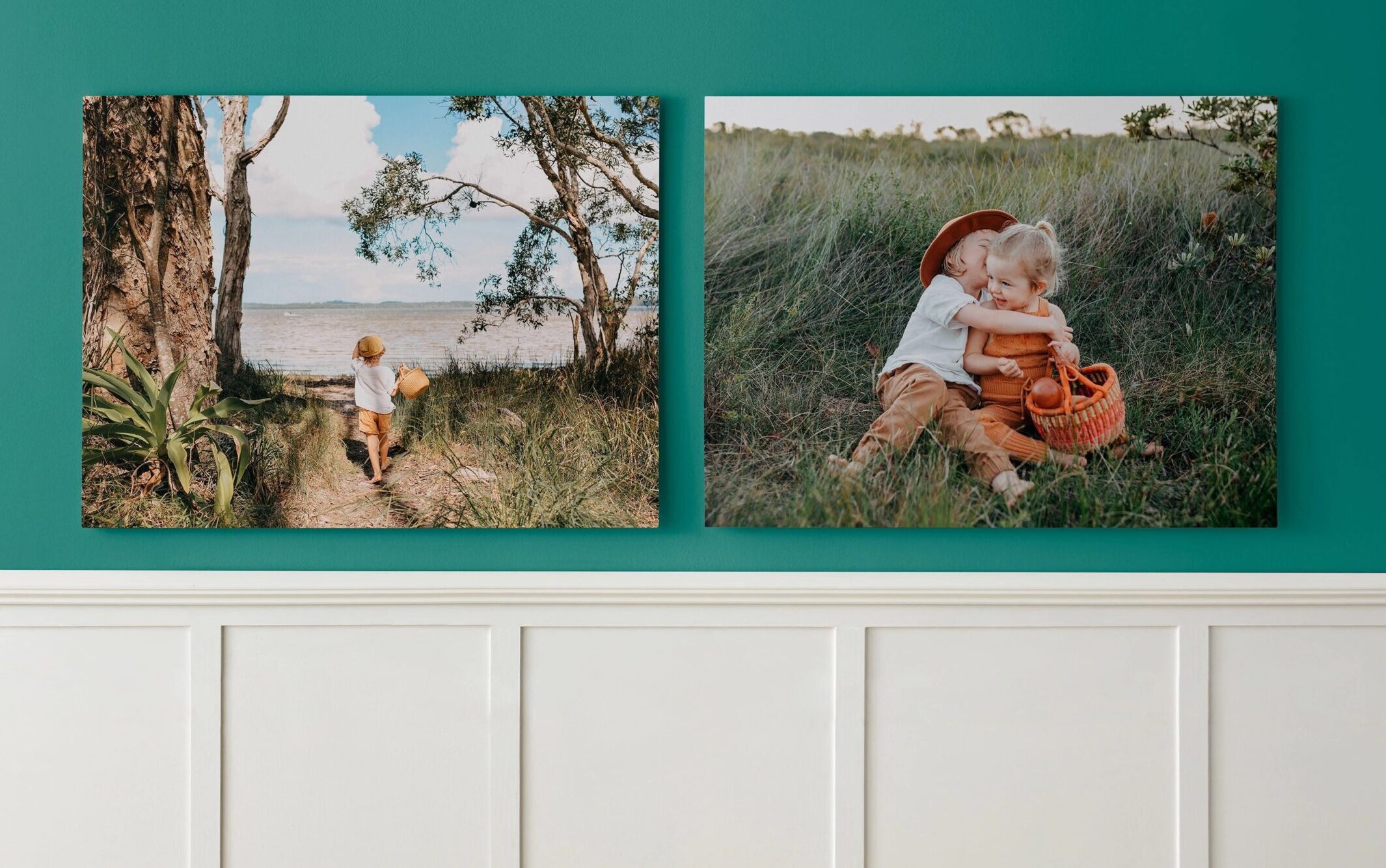 two metal prints hanging on the wall