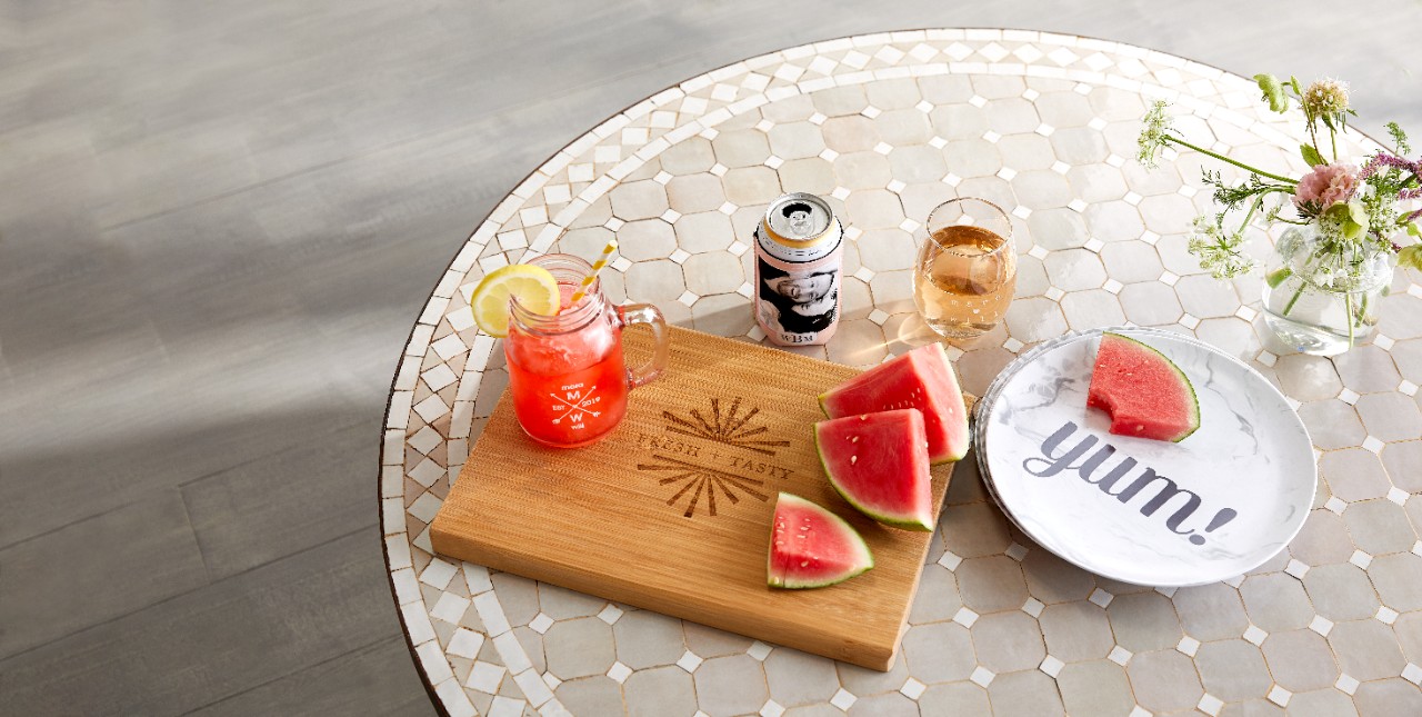 custom mason jar, wine glass, and cutting board on a table