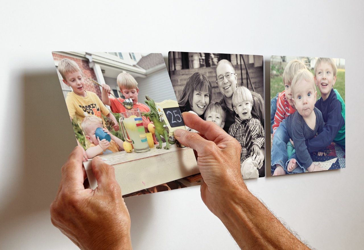 sticking photo tile on the wall