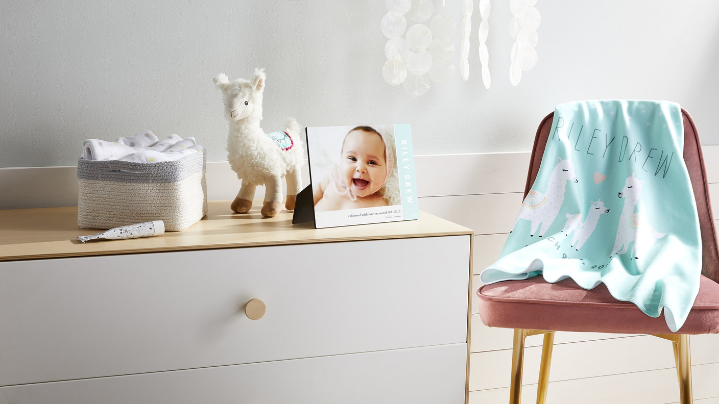 framed baby photo on table
