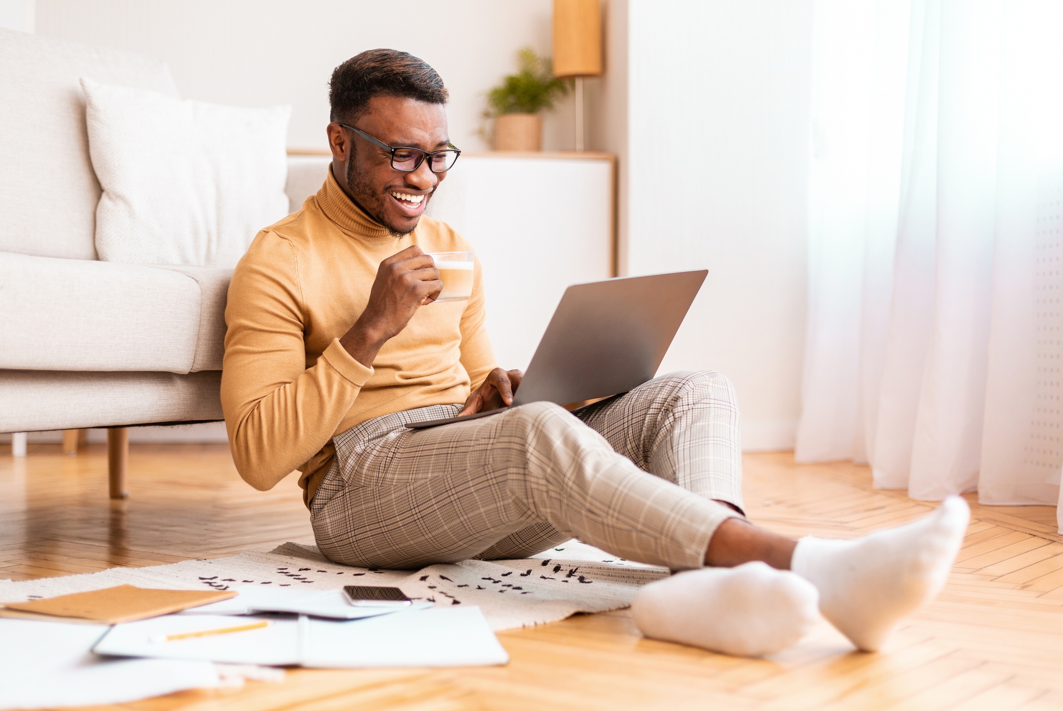 man playing a virtual game with his team while working from home