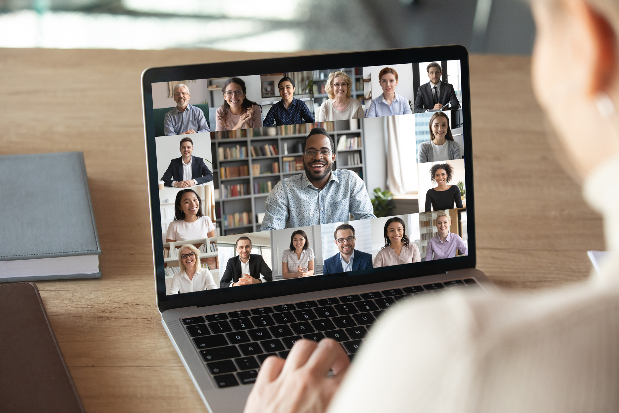 person on video chat with coworkers when working from home