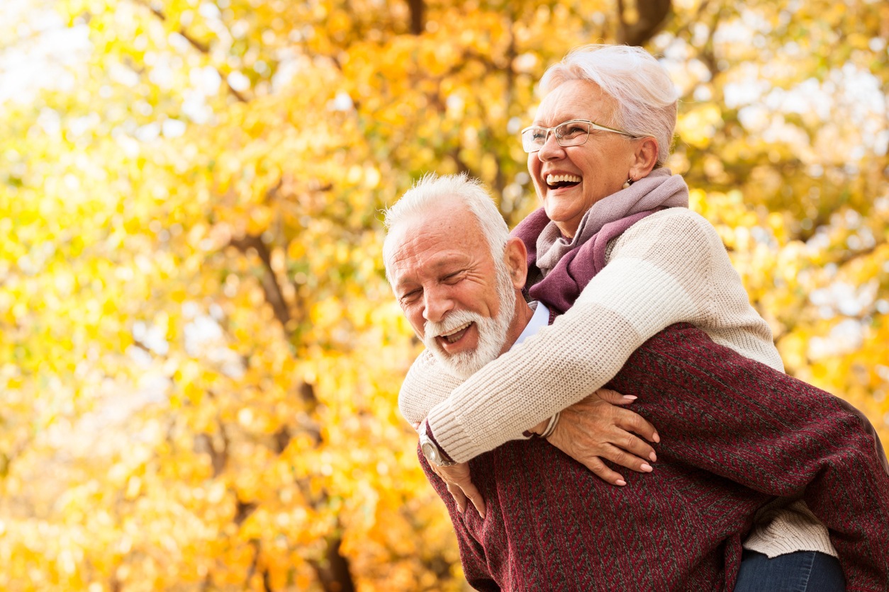 elderly couple laughing and having fun