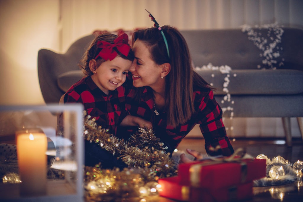 Mom and daughter on christmas night in matching outfits