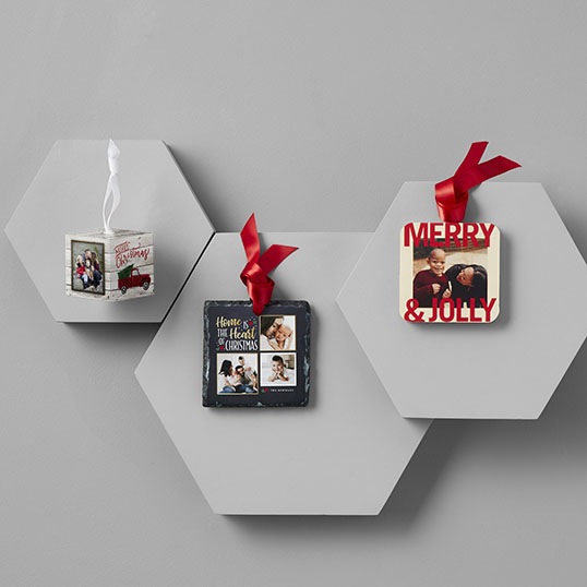 Christmas ornaments on a gray background with three different ornaments