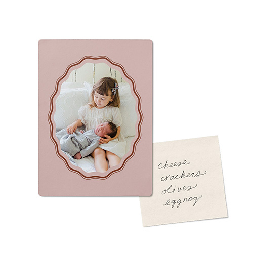 photo magnet with picture of little girl holding a baby