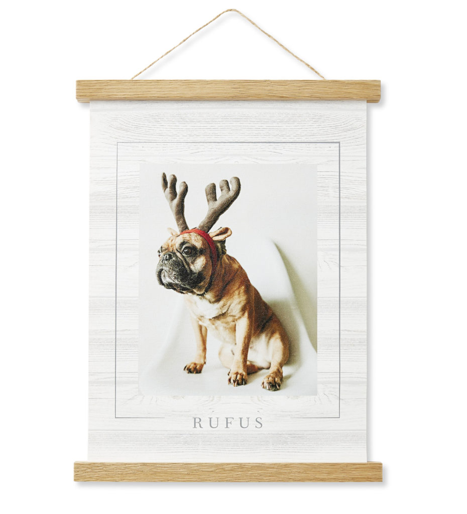 Hanging canvas with 2 natural wood rods with a dog and reindeer ears