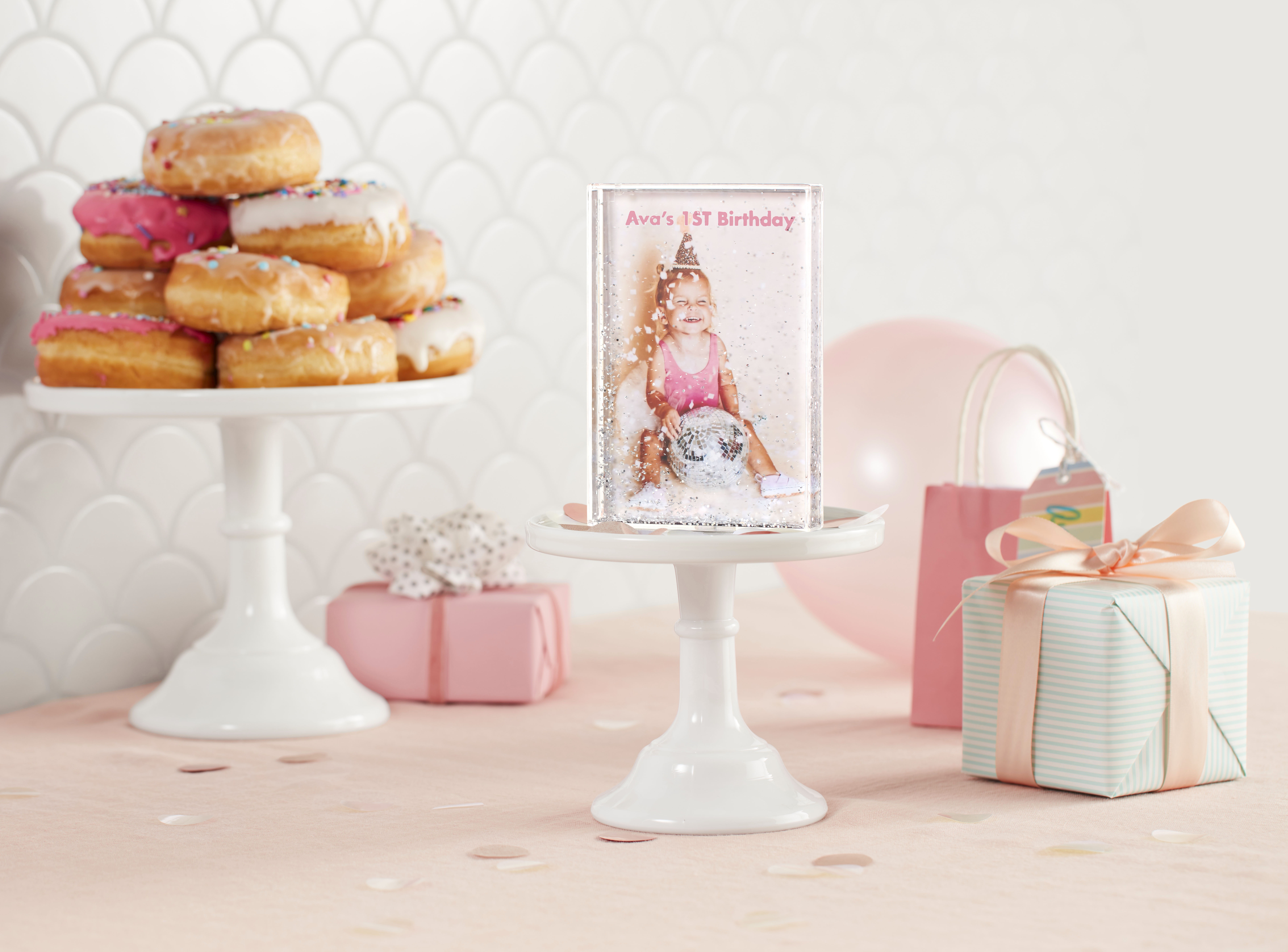 Glitter block with ava celebrating her first birtday and a donut stand