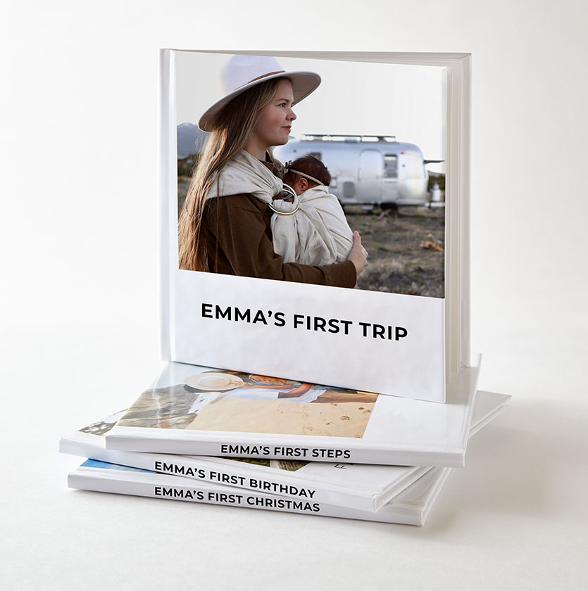 Stack of Shutterlfy instant books with photos of kids milestones