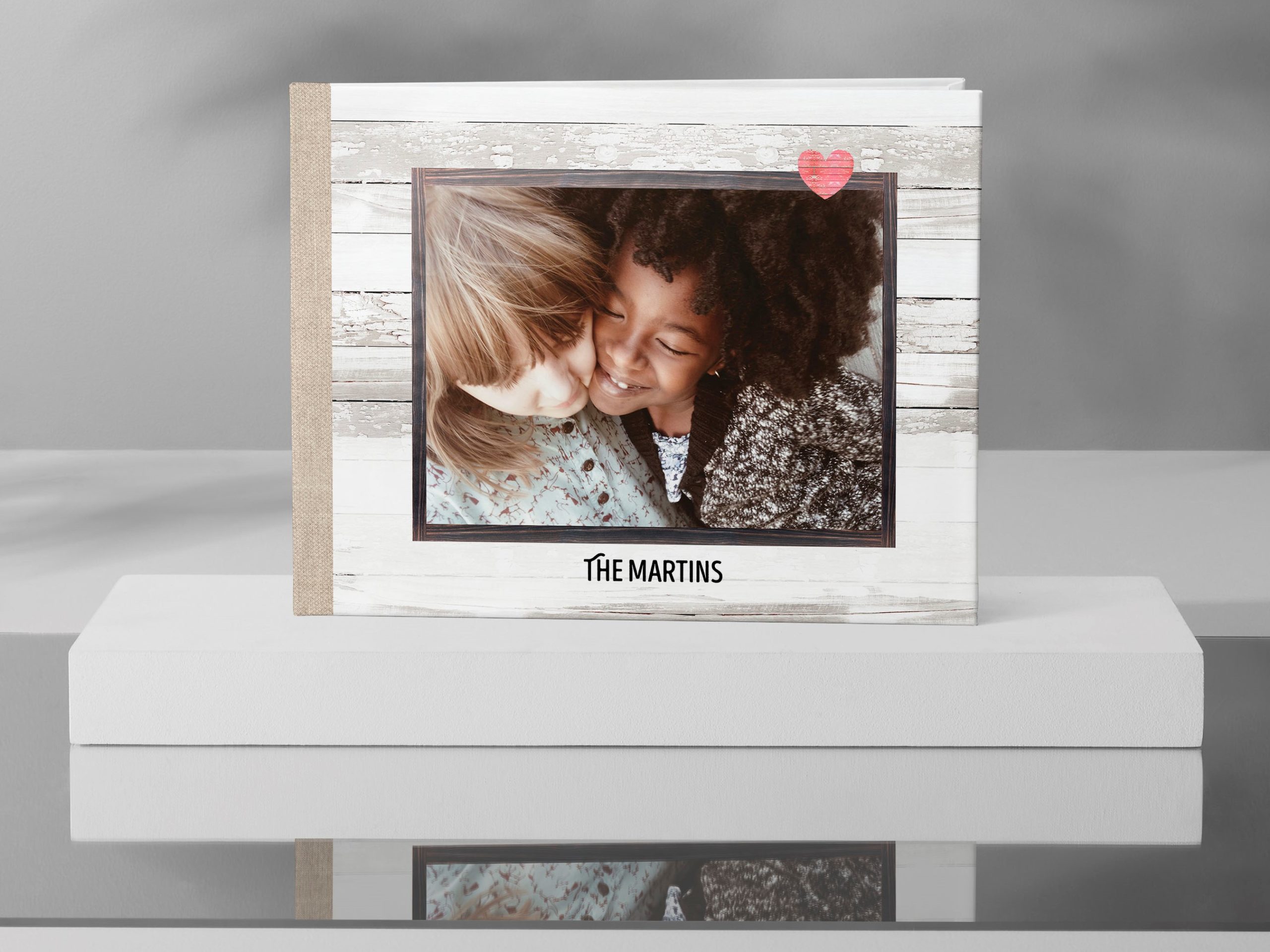 photo album with two girls on the cover hugging