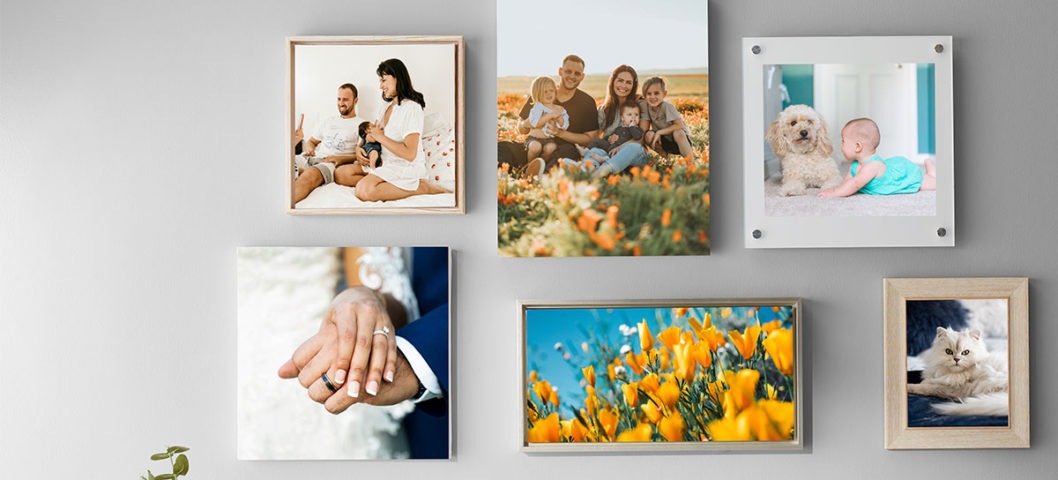 Gallery wall with six different photo prints in a variety of sizes and materials, including canvas print and acrylic prints