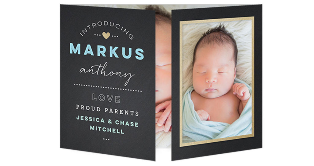 Baby boy tri-fold birth announcement with hospital photo of baby in blue blanket and blue letting on the card