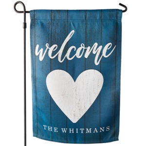 welcome yard flag with the last name and a heart image