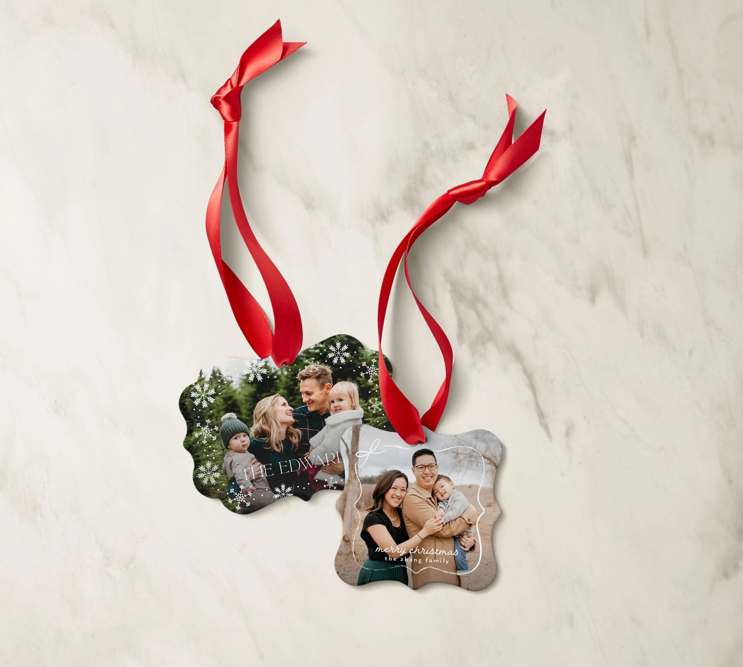 two metal christmas ornaments with photos of a family