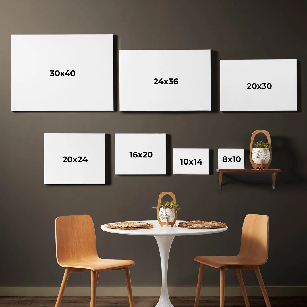 a variety of picture frame sizes displayed on a wall