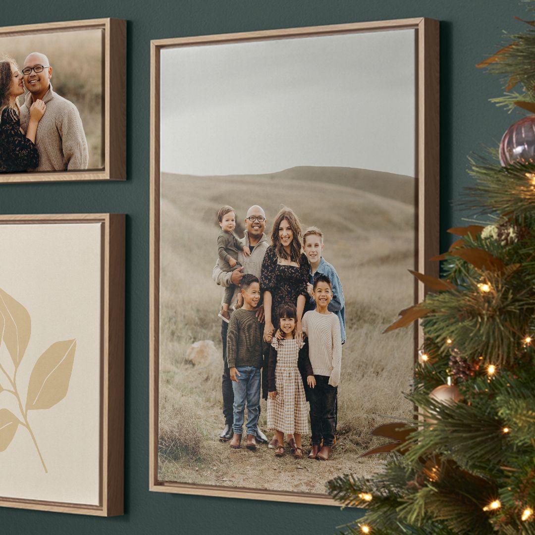 20x30 framed canvas print with family photo hanging on wall next to christmas tree