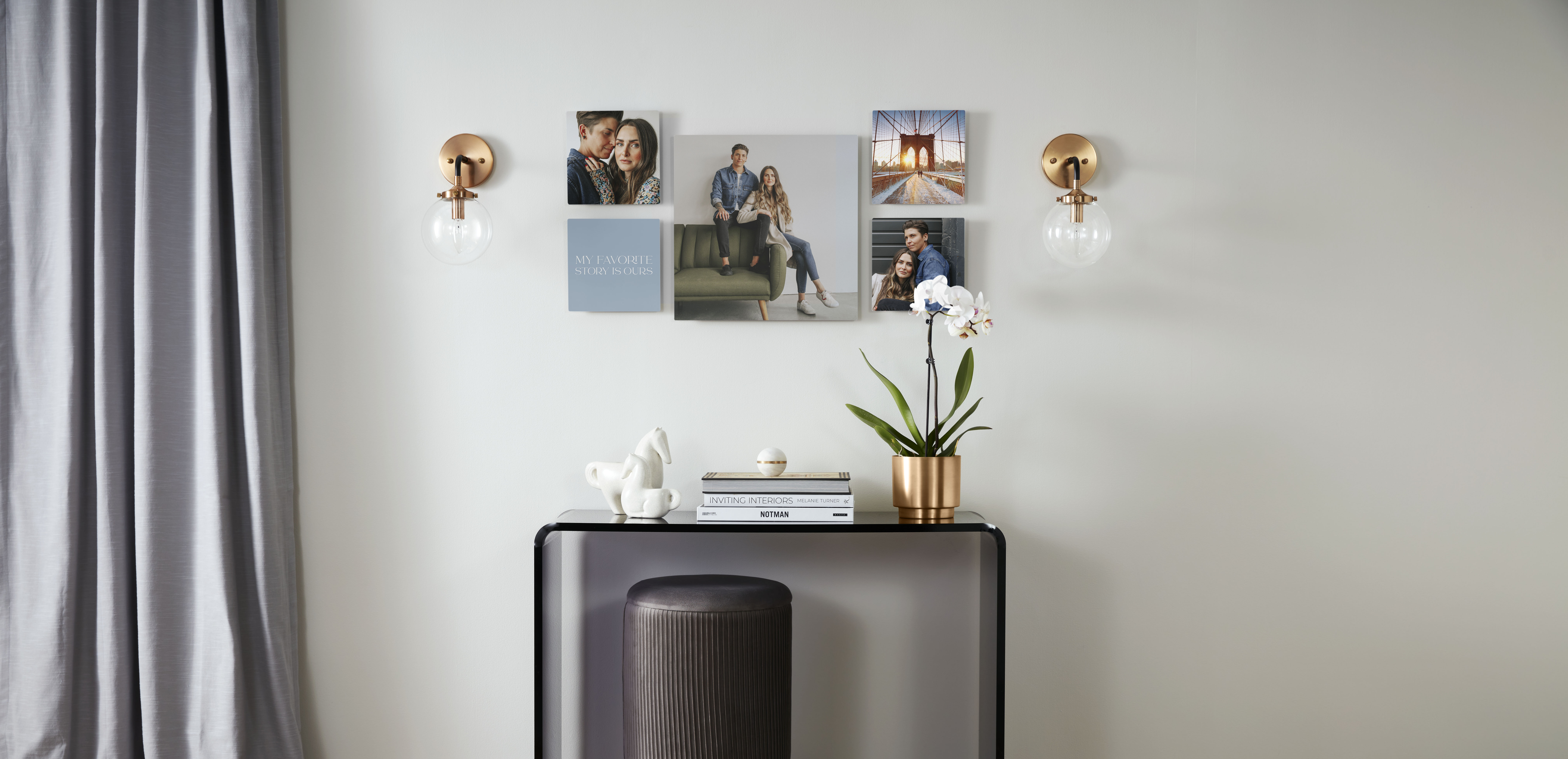 Gallery of five personalized metal photo tiles mounted on a gray wall featuring a couple and a desk with decorative books