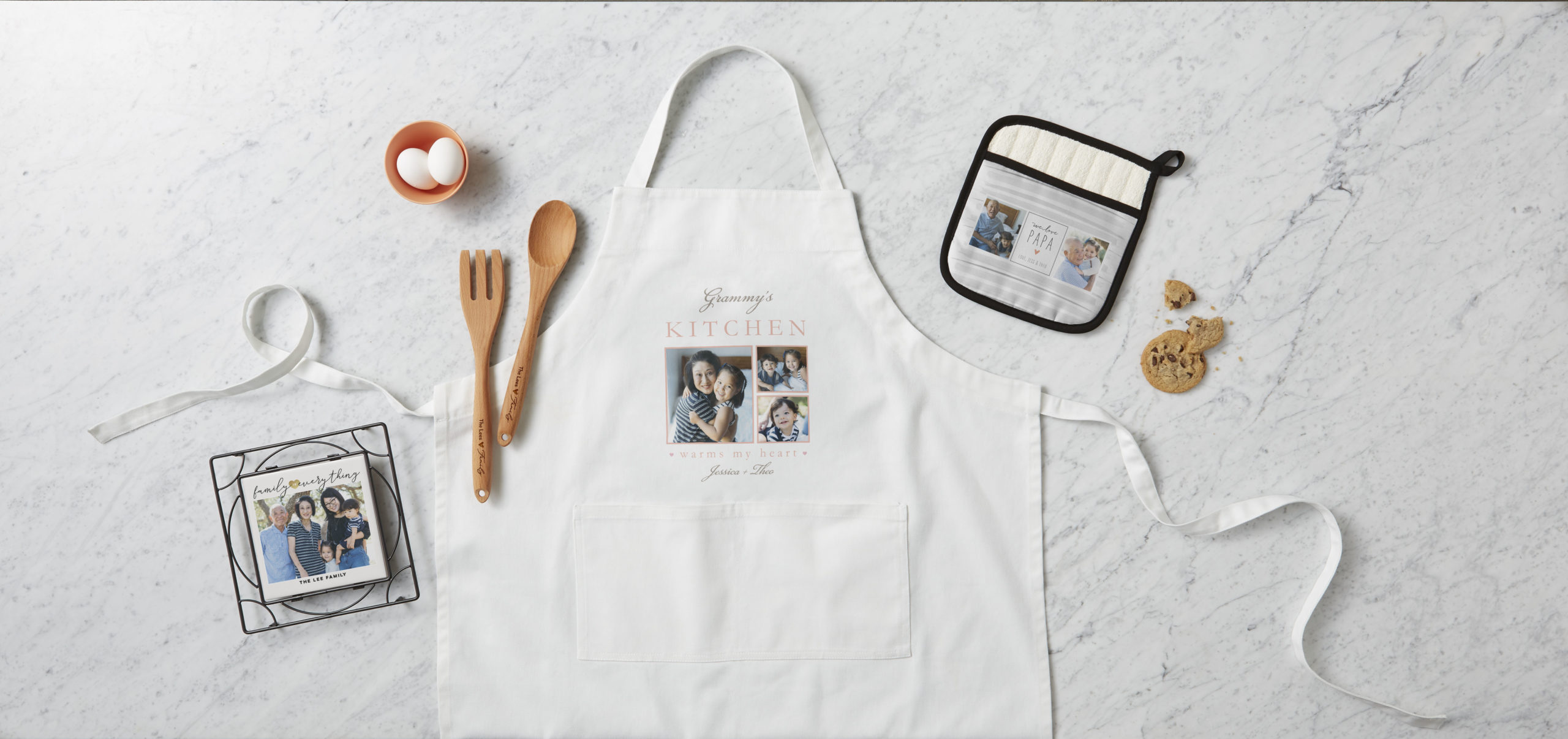 Grammys kitchen personalized apron featuring wooden kitchen utensils a ceramic trivet and pot holder