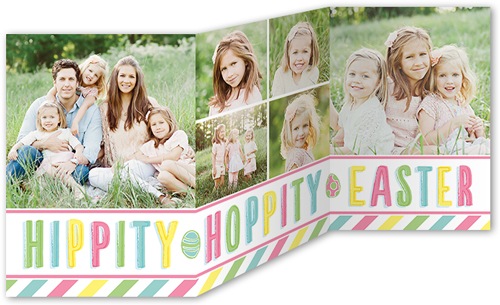 Trifold hippity hoppity Easter card featuring a family of five taking a photo while sitting on the green grass