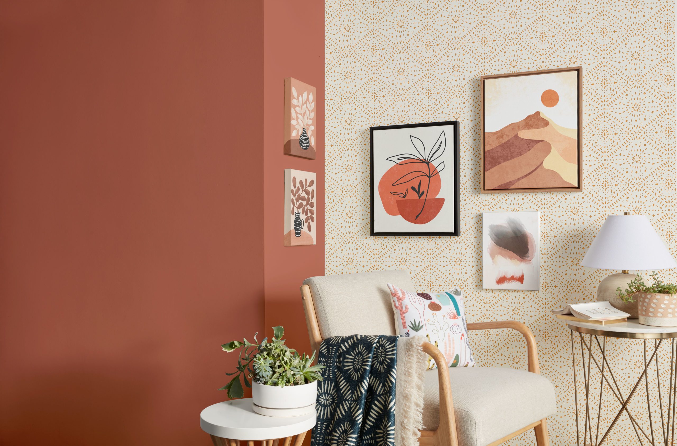 Living room decor with wall art, wallpaper, pillows, and blankets,