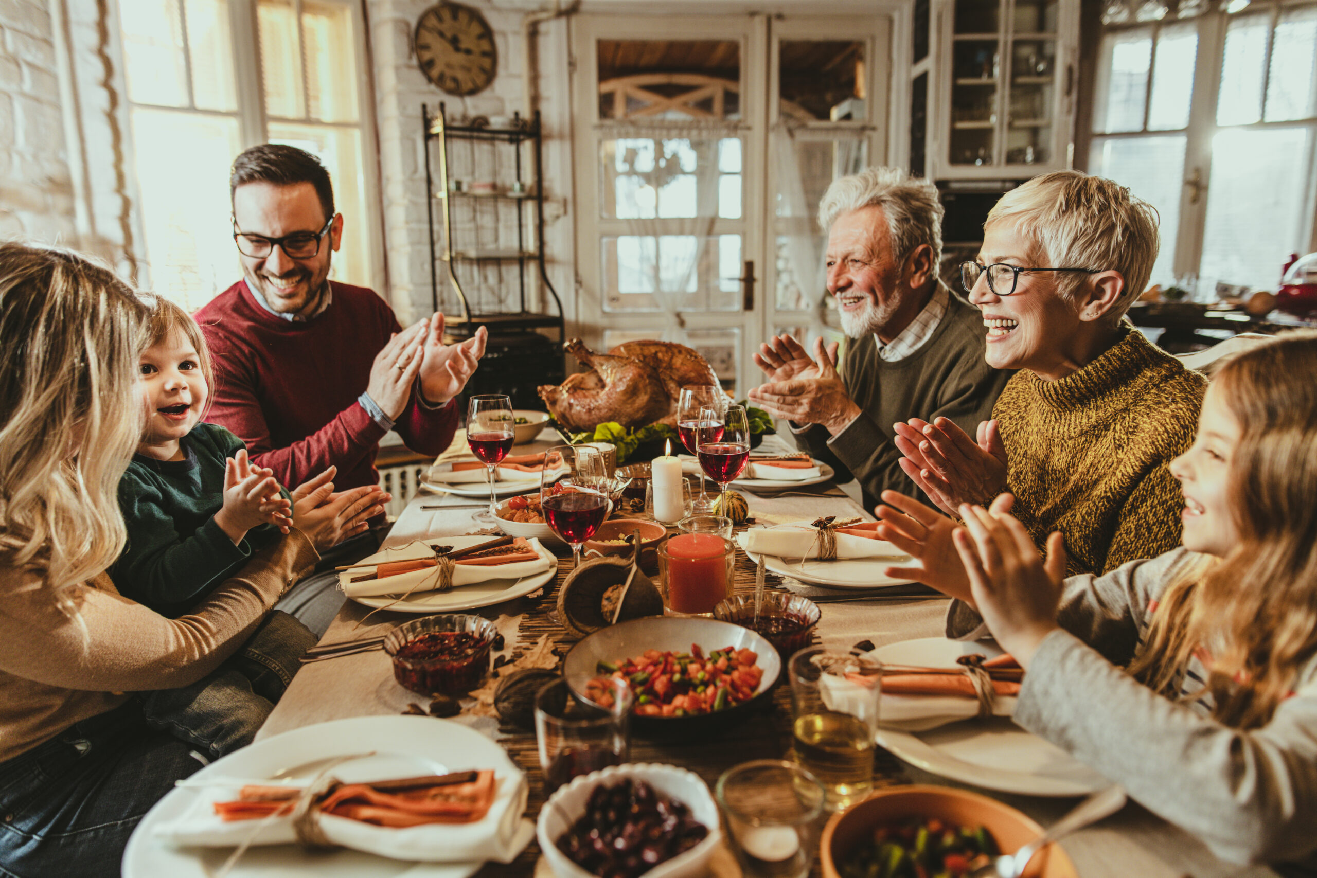 family at table on thanksgiving