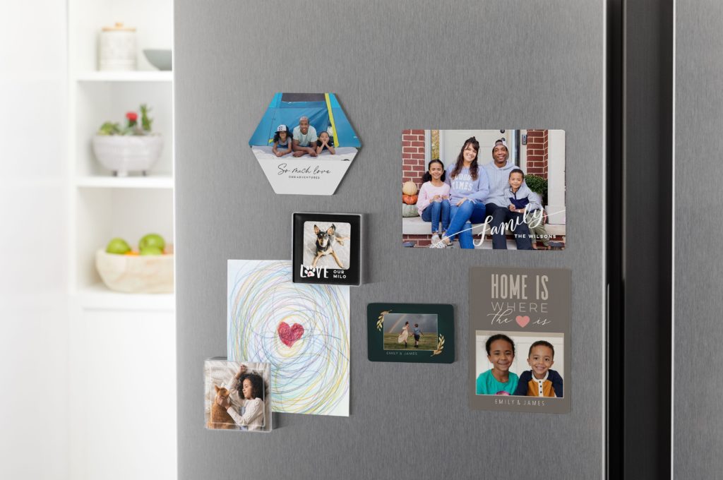 Custom photo magnets on a refrigerator