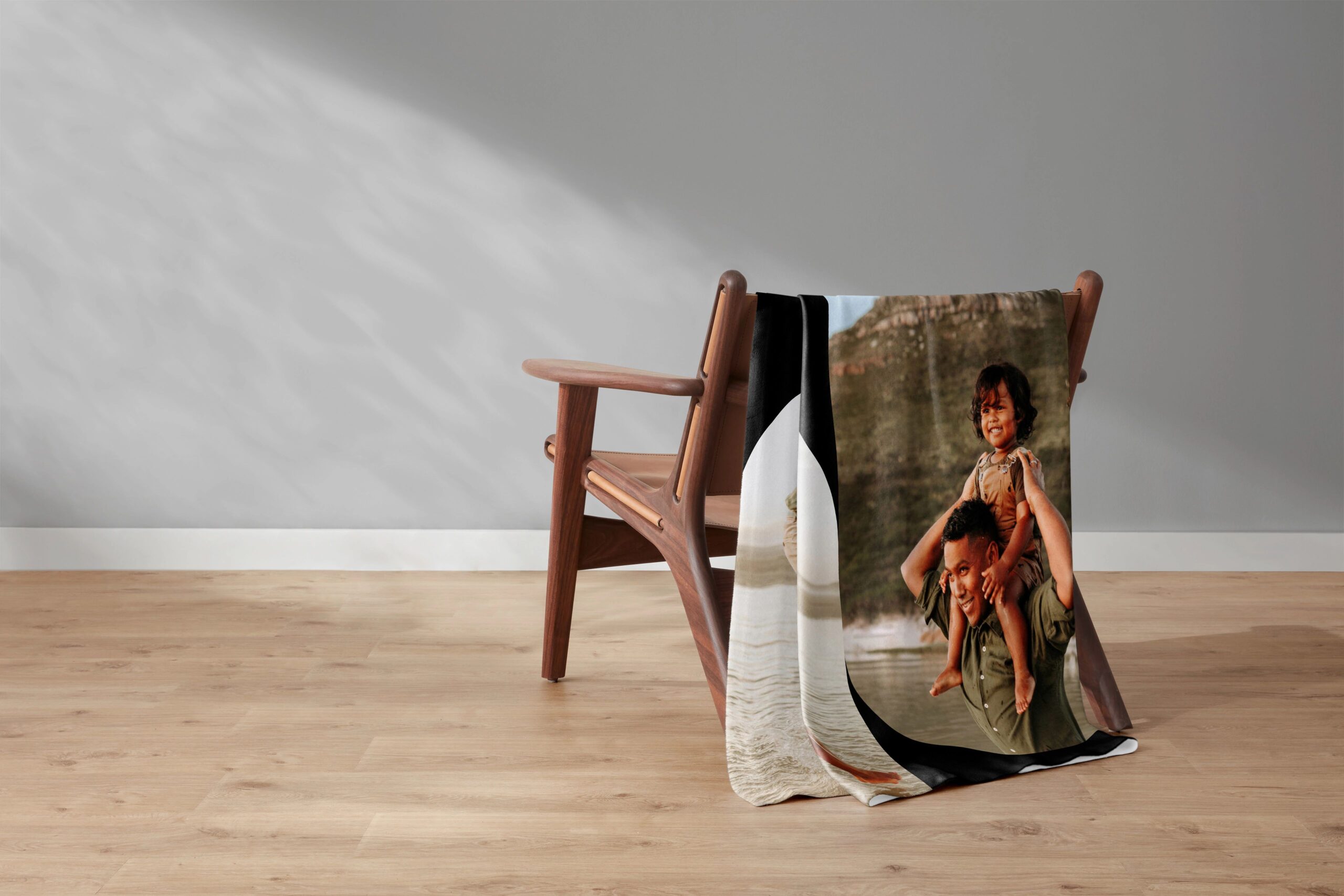 photo blanket draped over chair with a photo of a dad and his daughter