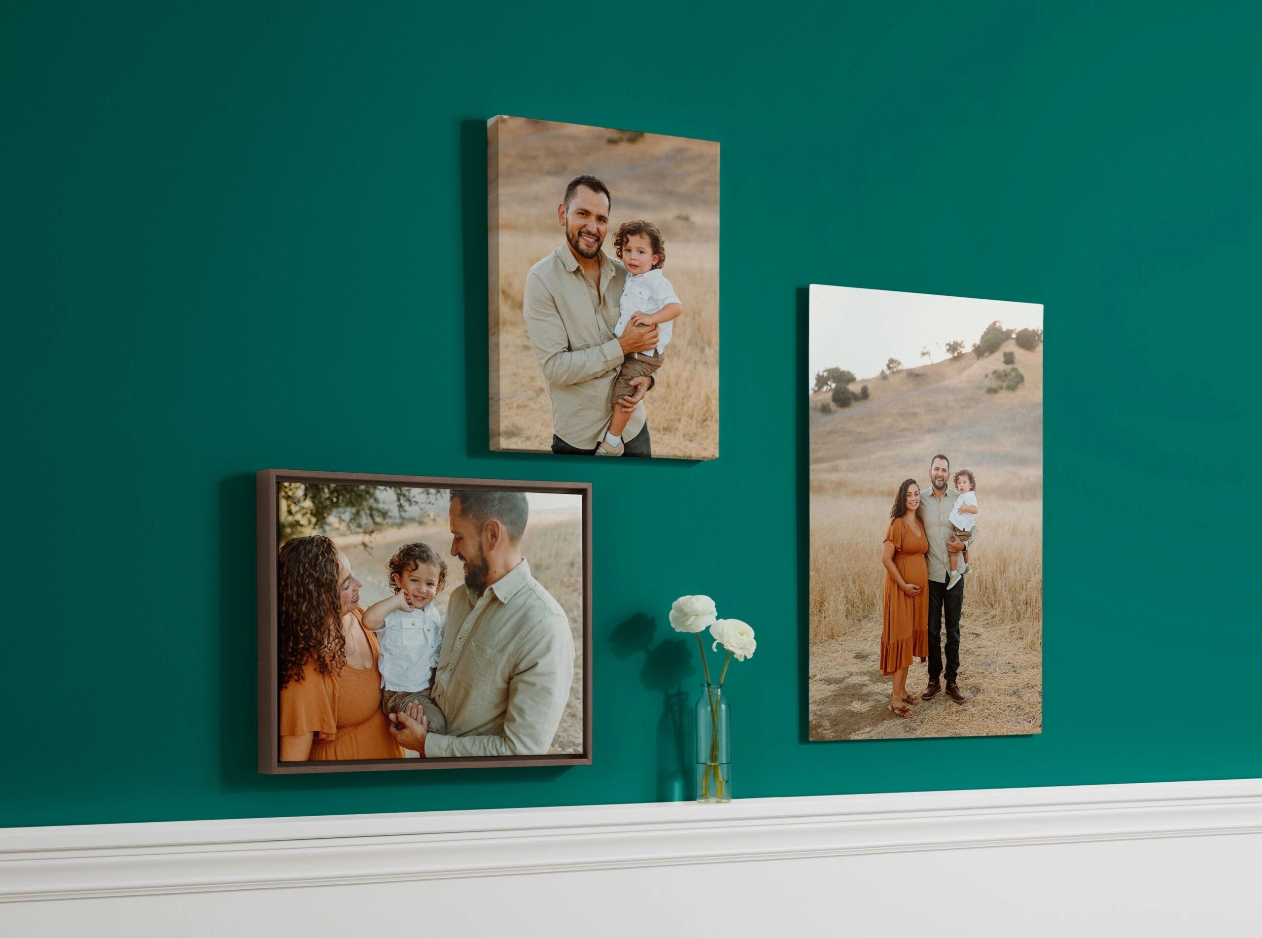 canvas prints and metal print with pictures of a family hanging on a wall