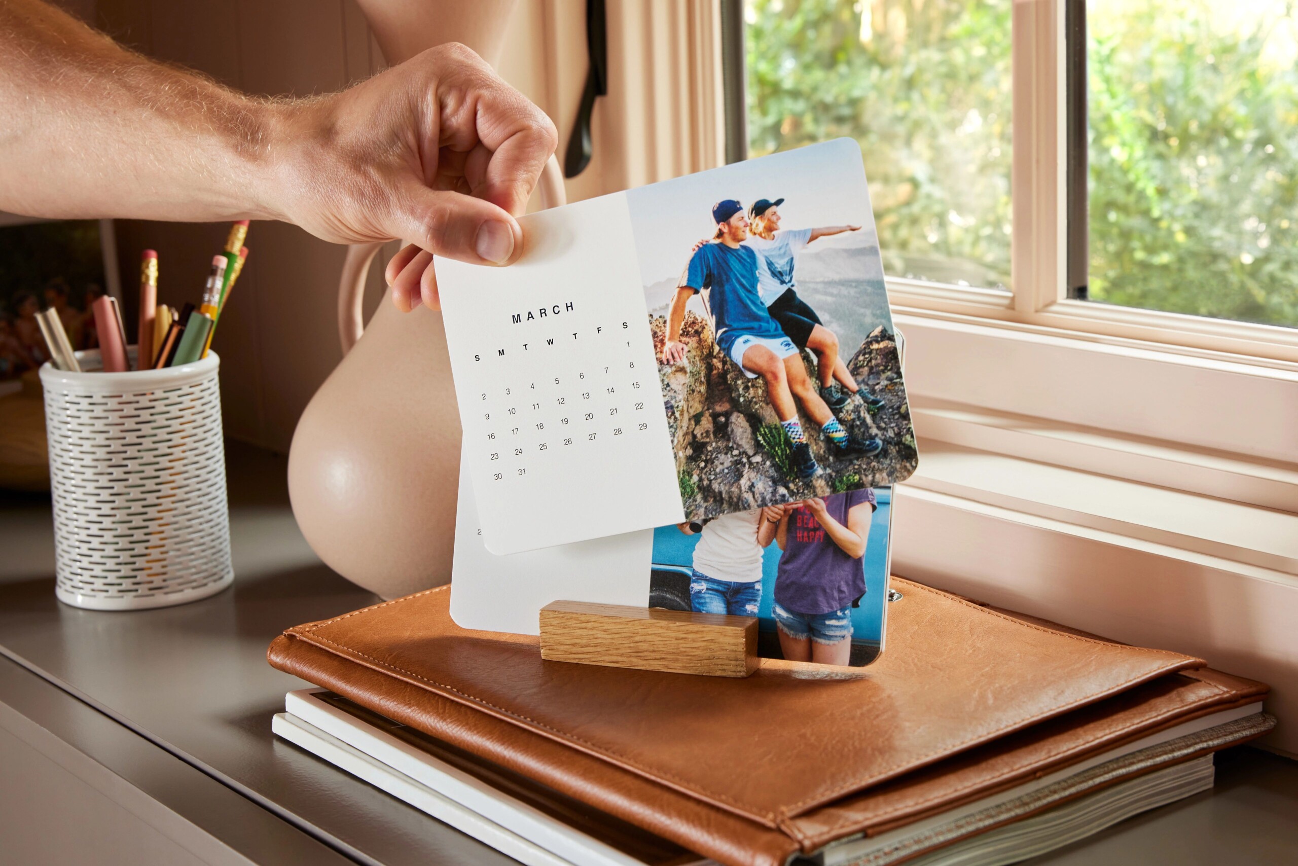 easel calendar with travel photos