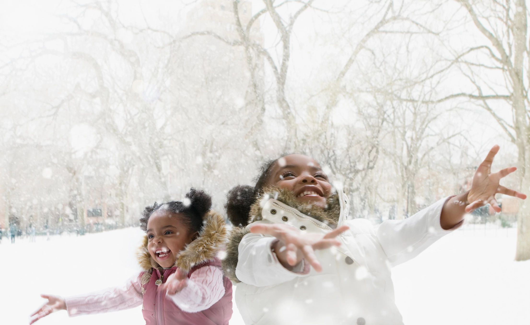 kids playing in falling snow