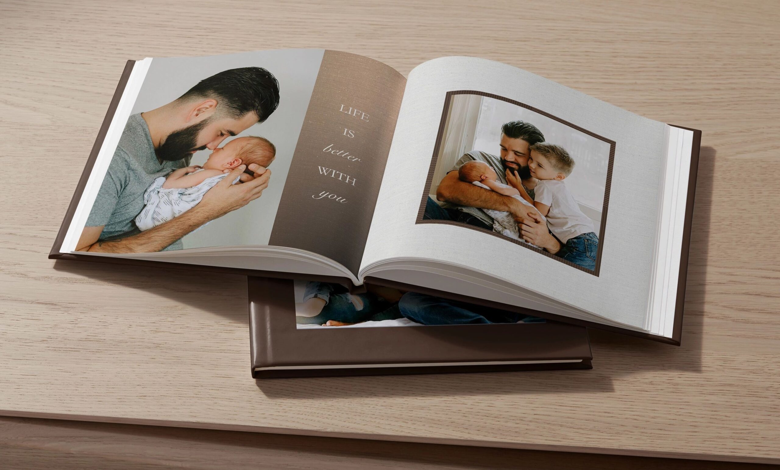 open baby photo book displaying photos of a baby and family